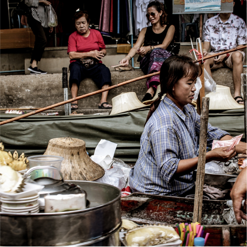 A Woman Selling Items at a Thai Market