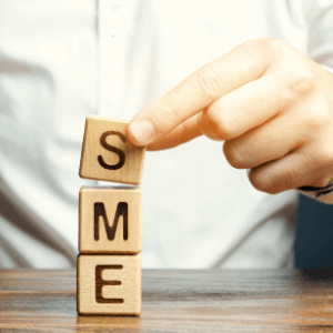 Three letter tiles, each respectively displaying the individual letters of S, M, and E, are stacked vertically on top of each other.