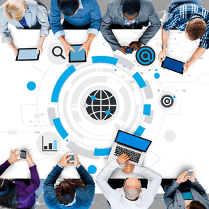 An illustration of 7 people working on either sides of a table together, at laptops. There is a symbol of a globe in the middle of the table. 