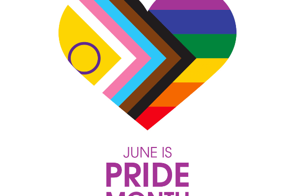 A progress pride flag in the shape of a heart with "June is Pride Month" written in purple text underneath it.